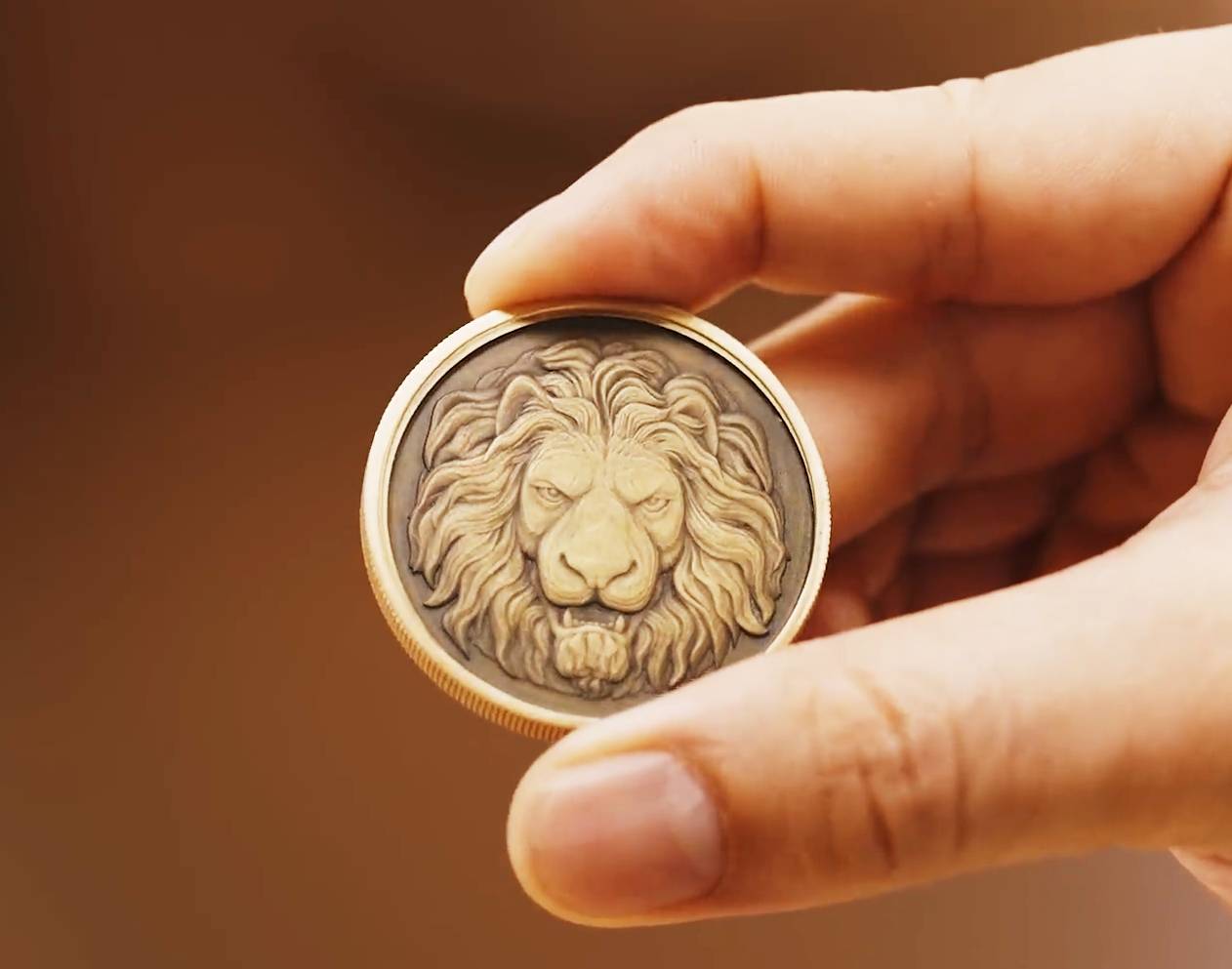 coin engraved with a lion image