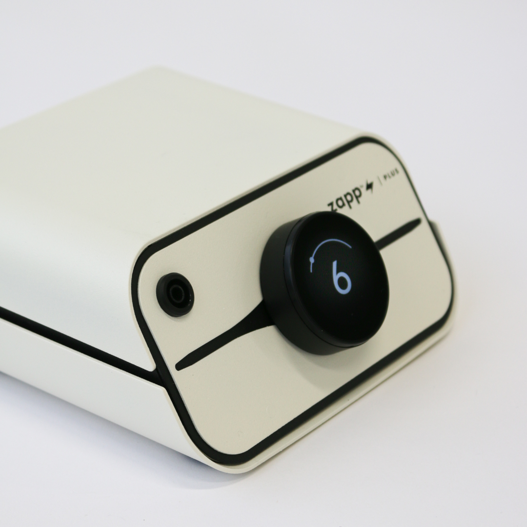 Zapp Plus White electronic device with a black knob and 'zapp' branding on a light gray background