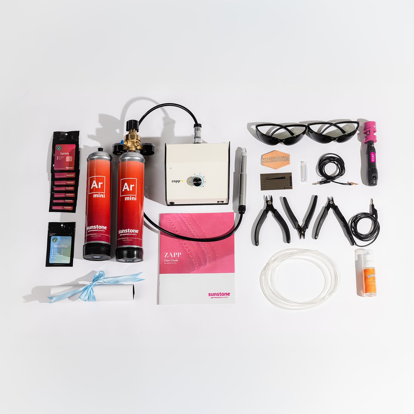 Zapp Welder collection of hair care products and tools on a white background