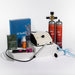 Zapp Welder PJ Toolkit with various items including a blue book, red canisters, and a white device on a white background.