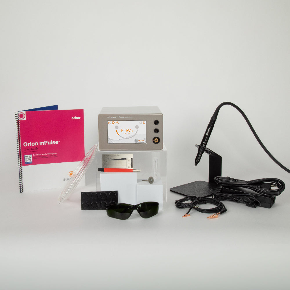 Orion mPulse welder including a device, notebook, safety glasses, and cables on a white background