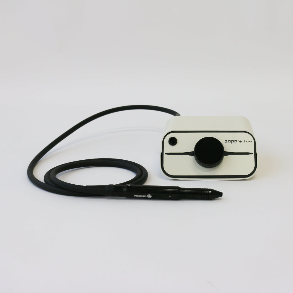 Zapp Plus Small electronic device with a black cable on a white background